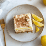 Lemon tiramisu slice on a rustic plate