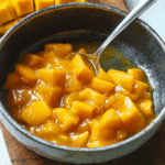Mango cake filling compote in rustic bowl