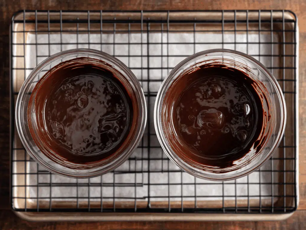 Cups coated with chocolate magic shell set upside down
