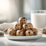 chocolate chip protein balls stacked on plate