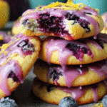 Blueberry Lemon Heaven Cookies with golden edges and lemon glaze