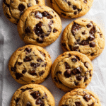 Top-down view of brown butter chocolate chip cookies on parchment paper