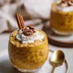 Creamy Pumpkin Spice Overnight Oats being served on beautiful dinnerware