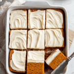 Top-down view of Gluten-Free Pumpkin Squares (Bars) in baking pan with cream cheese frosting