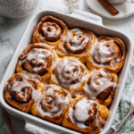 Pumpkin cinnamon roll casserole top-down view in baking dish