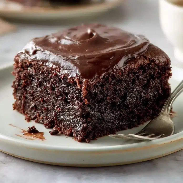 Delicious slice of buttermilk chocolate cake topped with frosting.