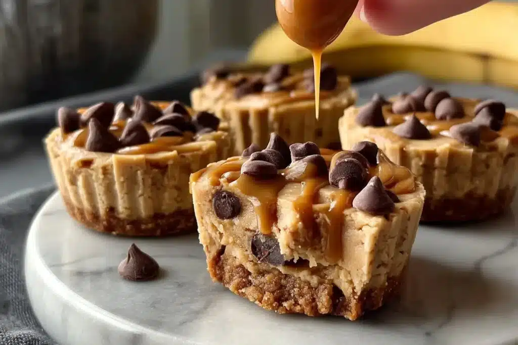Peanut butter banana cookie dough fudge cups stacked on a plate